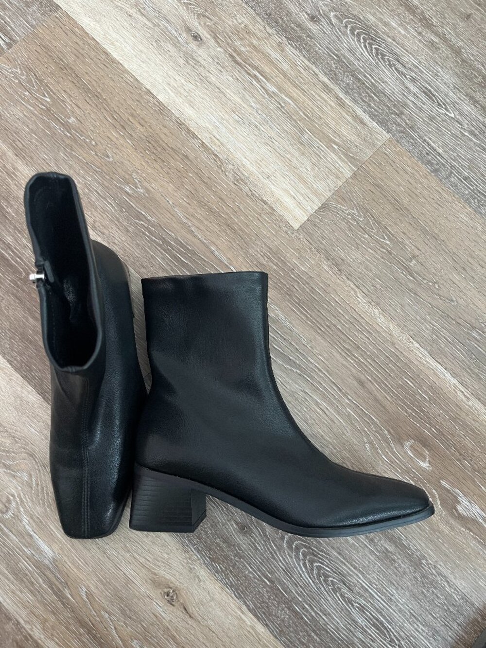 Sleek Minimalist Heeled Black Ankle Boot